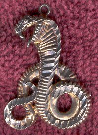 Gold and silver serpent charm.
